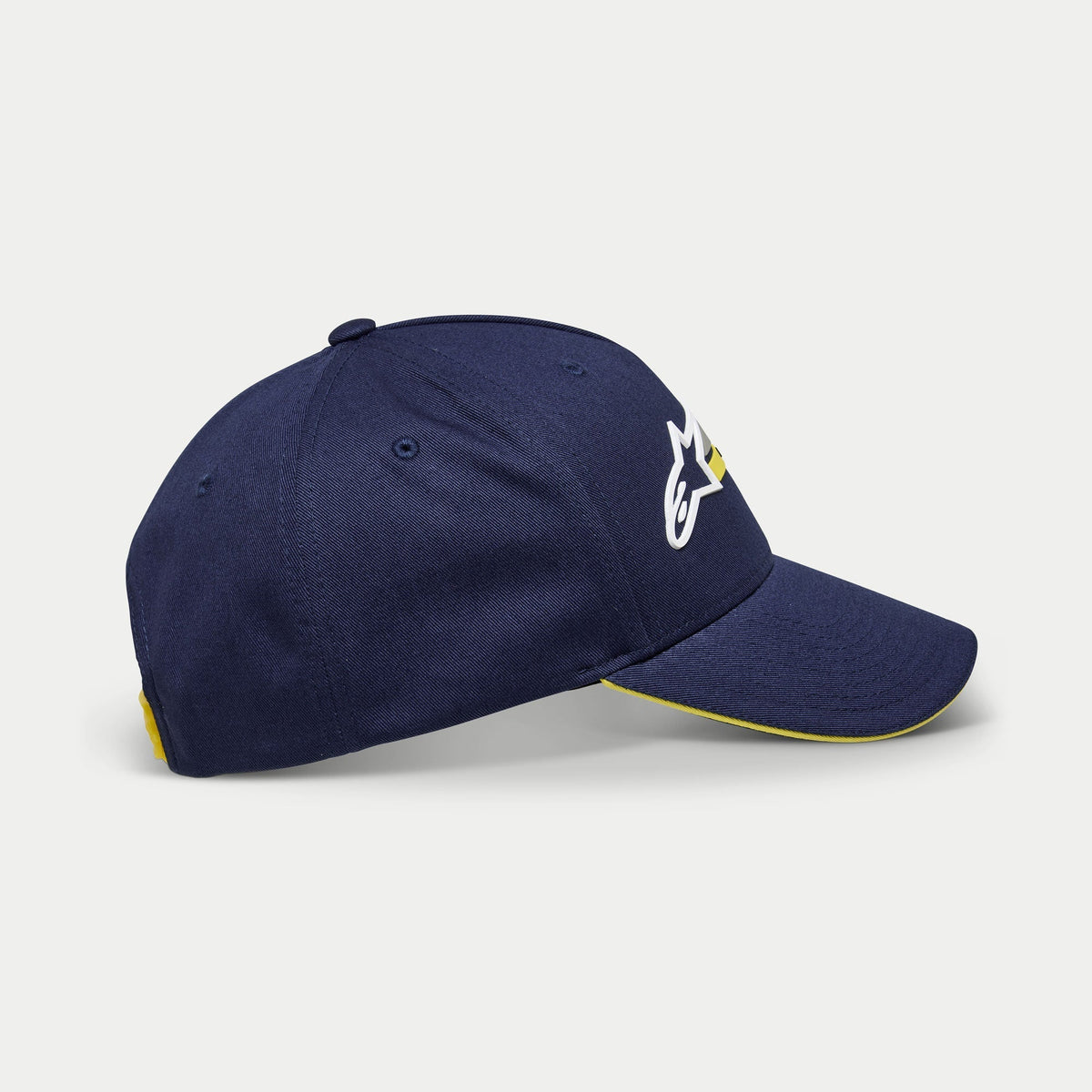 Alpinestars Par Hat, Navy Blue Baseball Cap, side view showing white and yellow logo embroidery, curved bill with yellow sandwich trim, casual structured headwear