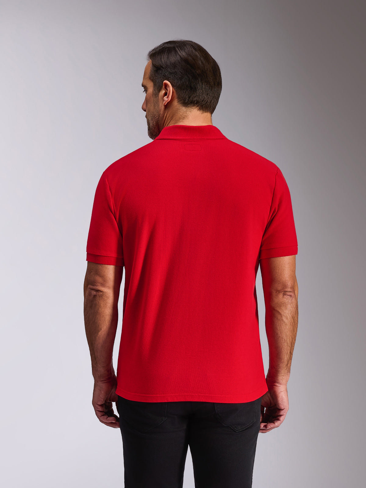 Alpinestars Endeavor Classic Polo, Short Sleeve Polo Shirt, Red, Back view on model, featuring ribbed collar and sleeve cuffs, casual motorsport-inspired streetwear