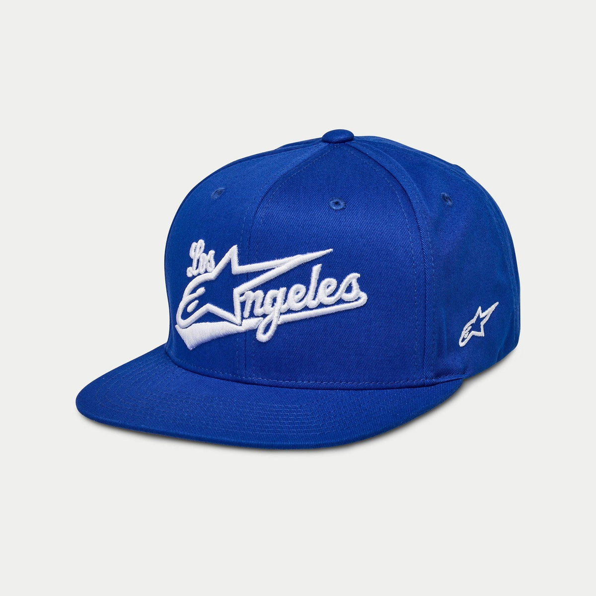 Boné Alpinestars Los Angeles, boné snapback de aba reta, azul com bordado 3D 'Los Angeles' branco em fonte atlética, logótipo Ageless lateral, coroa estruturada, estilo casual inspirado no desporto motorizado