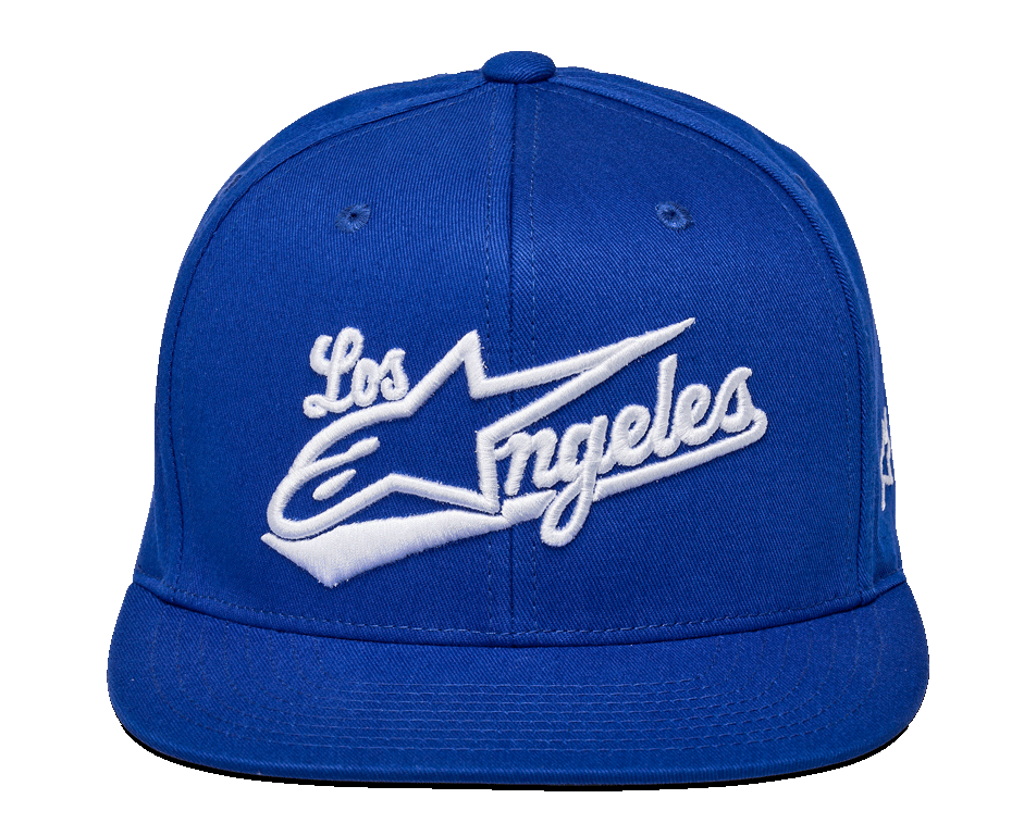 Alpinestars Los Angeles Hat, boné snapback azul, bordado 3D branco com fonte atlética 'Los Angeles' e logótipo Ageless, coroa estruturada, aba reta, sportswear casual streetwear