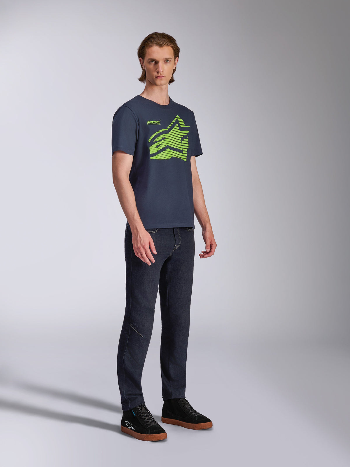 Alpinestars Fasting CSF Tee, Short Sleeve T-Shirt, Navy Blue, Lime Green Geometric Astars Logo, worn with dark jeans and black sneakers, Casual Motorsport Streetwear