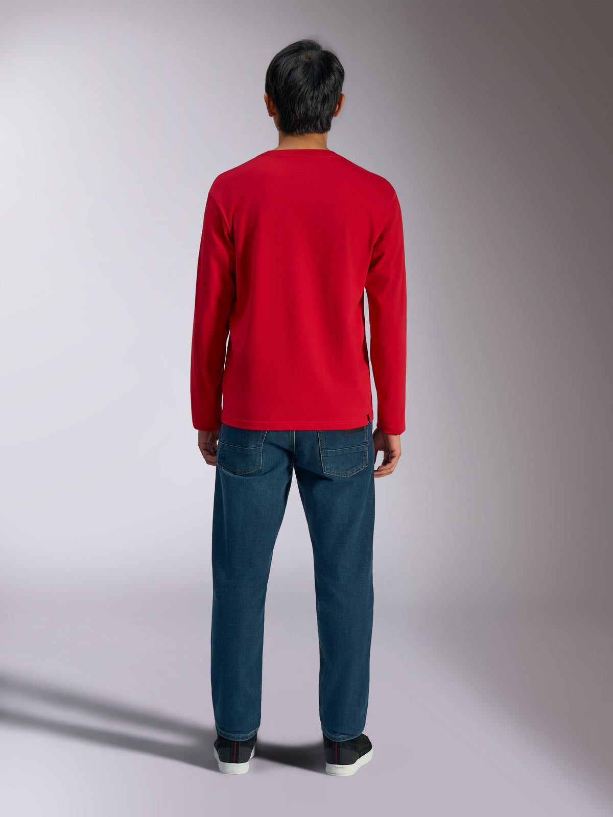 Alpinestars Trackside CSF Tee, Long Sleeve T-Shirt, Red, back view of model wearing the shirt with blue jeans, casual motorsport-inspired sportswear