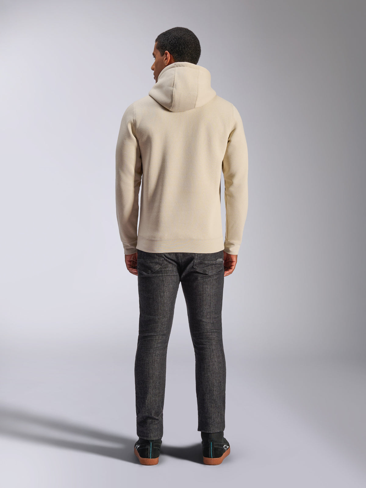Alpinestars Ageless V3 Hoodie, back view, off-white hooded sweatshirt, casual lifestyle wear, worn with dark grey jeans, ribbed hem and cuffs, clean minimalist design