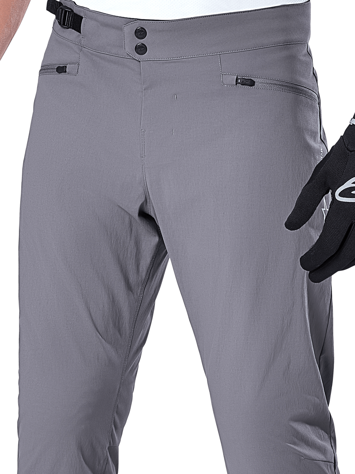 Alpinestars A-Dura Pants, calças de MTB, cinza escuro, grande plano da zona da cintura com fecho duplo de pressão, ajuste lateral e bolsos com fecho de correr, tecido elástico durável para mountain bike