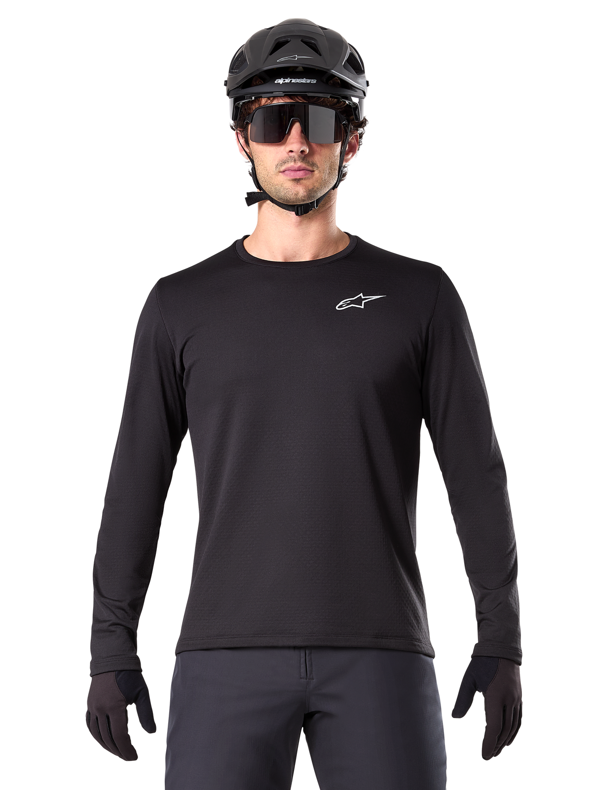 Alpinestars A-Dura Thermal Jersey, Black long-sleeve mountain bike jersey, worn with a black helmet and large sunglasses, featuring a small white Alpinestars logo on the chest, regular fit, MTB cycling apparel