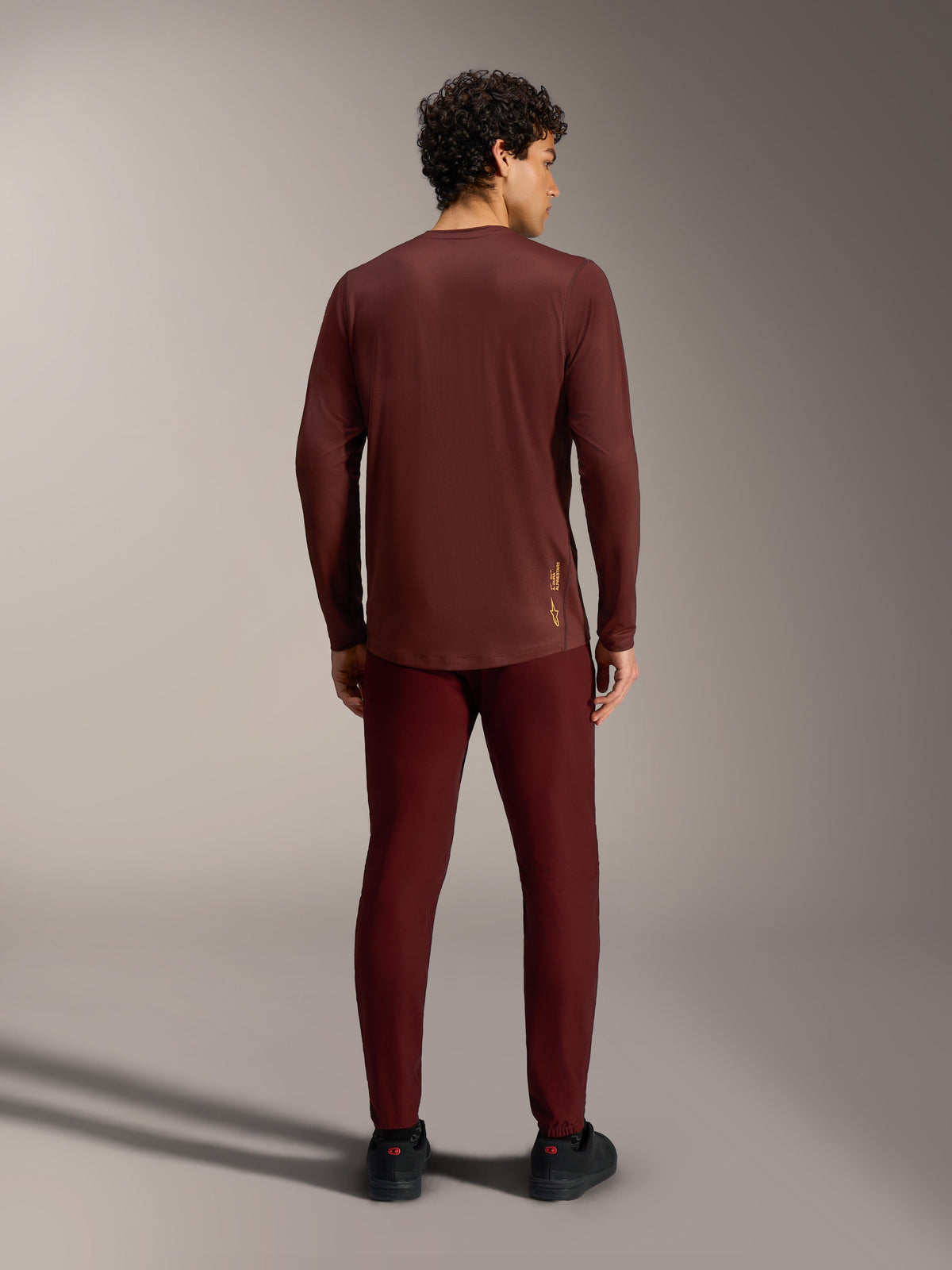 Bordeaux A-Dura Ride Long Sleeve Jersey, back view, featuring a small yellow Alpinestars logo on the lower back.