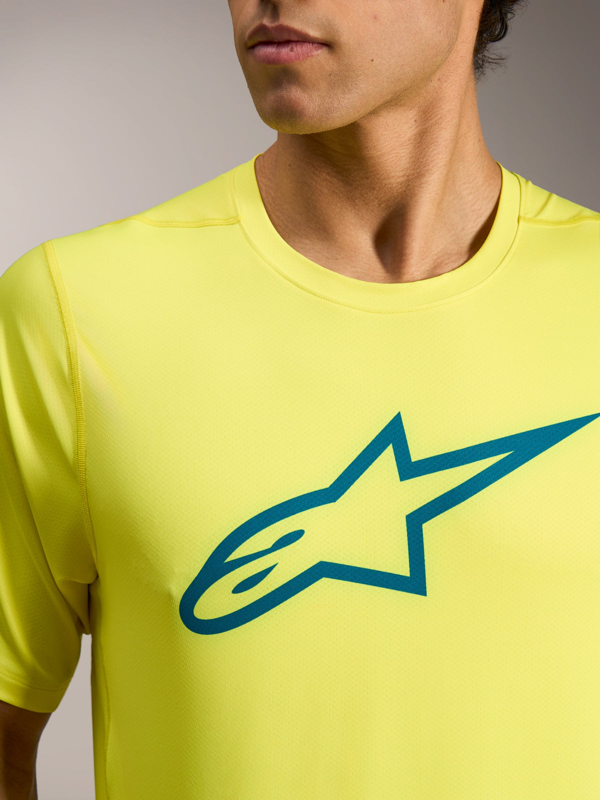 Camisola de manga curta A-Dura Ride Amarelo Fluo com logótipo Astars azul-petróleo, vestuário técnico de BTT.