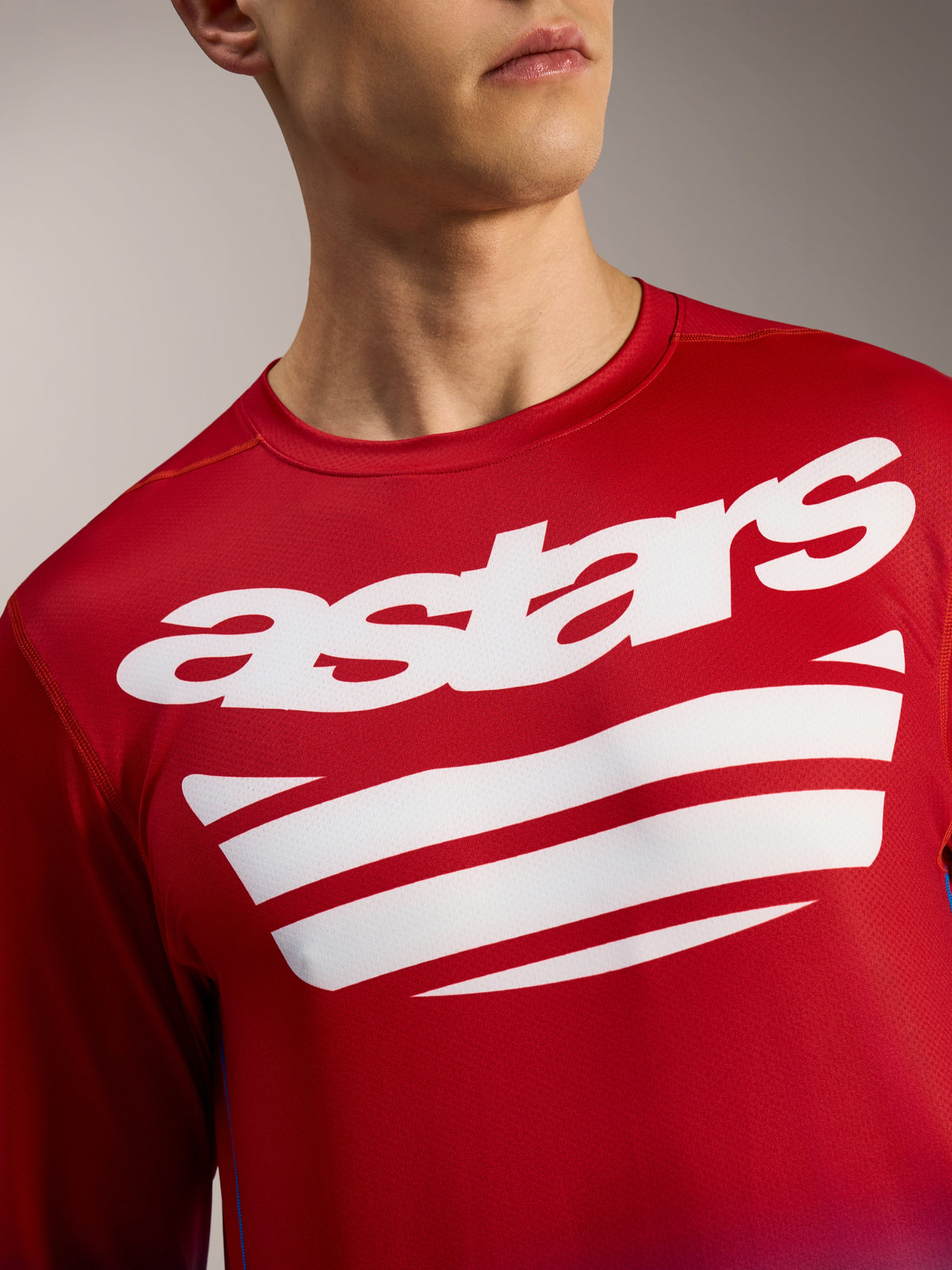 Alpinestars A-Dura ASTARS 2.0 Long Sleeve Jersey, bright red MTB top with white chest wordmark and stripe graphics.