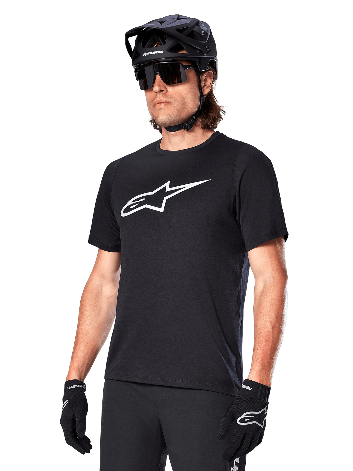 Alpinestars A-Dura Dri Oscar Jersey, Short Sleeve MTB Cycling Shirt, Black with white logo, moisture-wicking performance fabric, worn with black helmet, sunglasses, and gloves