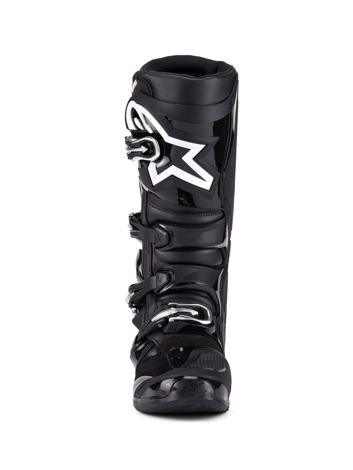 Botas Alpinestars Tech 7, botas de motocross, pretas, vista frontal com sistema de fecho de quatro fivelas, logótipo de estrela da Alpinestars proeminente a branco na placa da canela, estrutura em TPU durável e proteção reforçada para competições de todo-o-terreno.