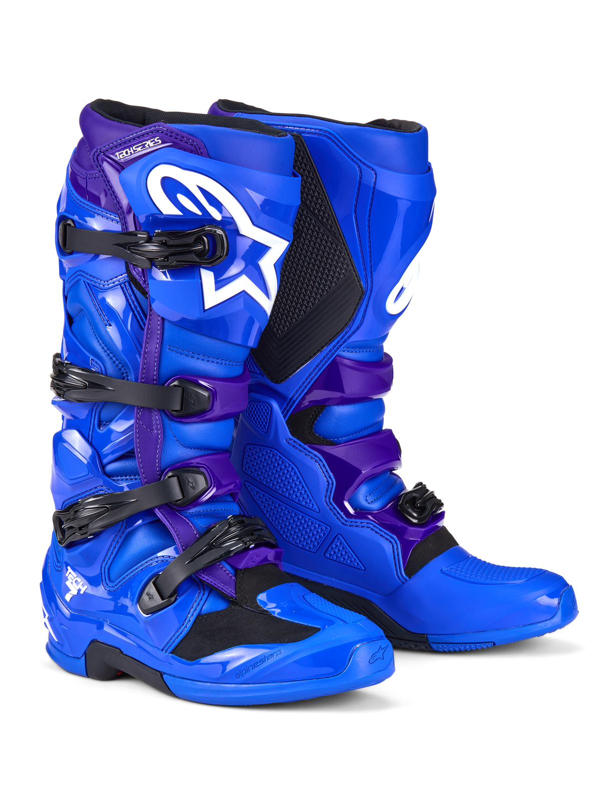 Botas Alpinestars Tech 7, botas de motocross, azul e roxo, com logótipos Alpinestars brancos, painéis de proteção em TPU, sistema de fecho de quatro fivelas e design de sola robusta para todo-o-terreno