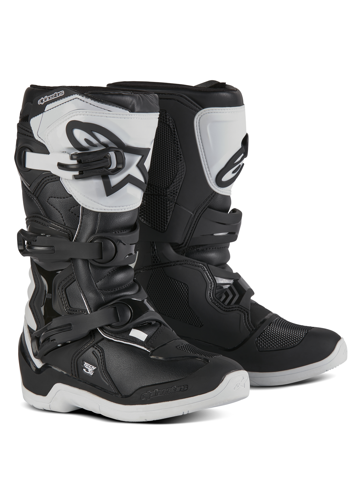 Botas Alpinestars Youth Tech 3S, botas de motocross para jovens pilotos, pretas e brancas, com três fivelas ajustáveis, caneleira em TPU branca com o logótipo Alpinestars, proteção reforçada de estrutura rígida e sola robusta branca com ranhuras, design de corrida todo-o-terreno