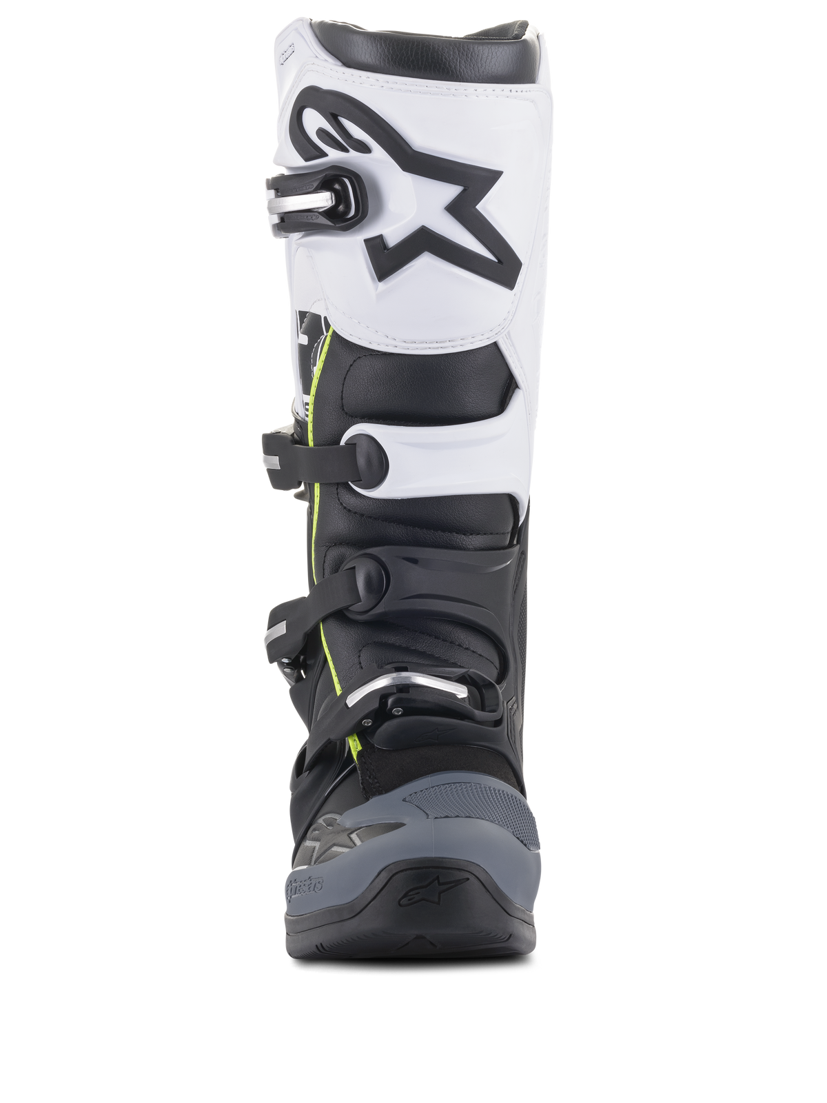 Botas Alpinestars Tech 5, botas de motocross, pretas, cinzento escuro e brancas, vista frontal com sistema de fecho de múltiplas fivelas, painel superior branco com logótipo Astars preto, biqueira reforçada em cinzento escuro e detalhes amarelos subtis