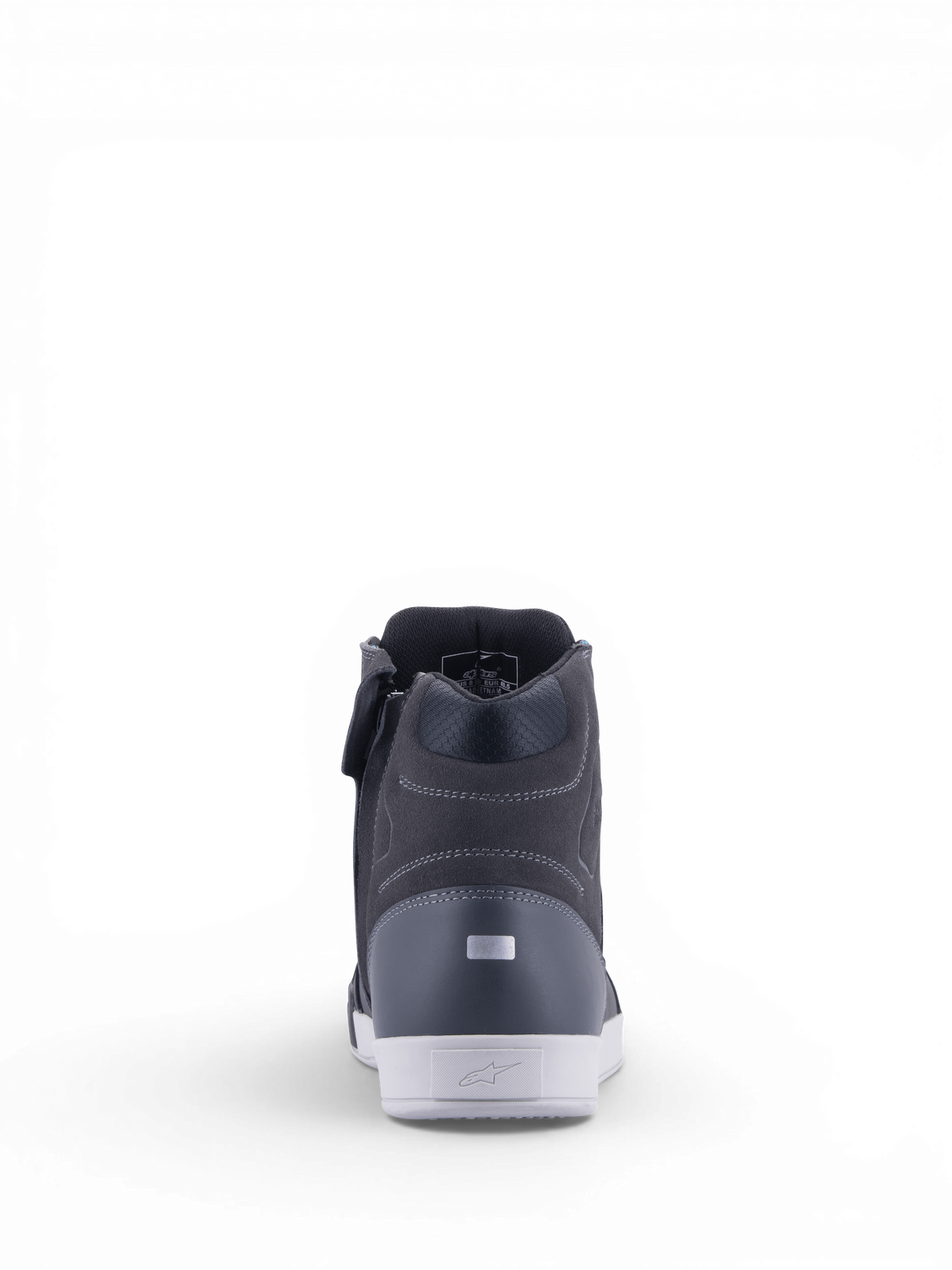 Alpinestars Sapatos Chrome Drystar® para mulher, sapatos de moto urbanos em preto e cinza asfalto, vista do calcanhar com detalhe refletor e sola branca.