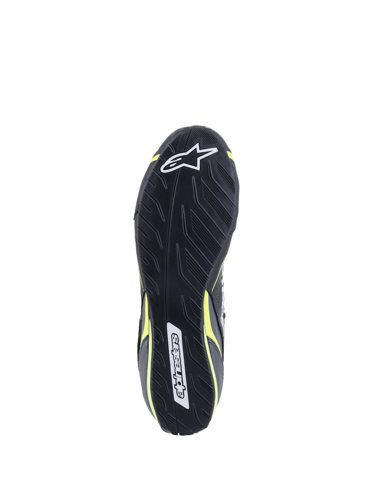 Sapatos Alpinestars Tech-1 T V3 FIA, vista da sola, pretos com detalhes em amarelo néon, sola de borracha inspirada no padrão de rasto de pneus assimétrico, com logótipos Alpinestars e padrão texturizado para sensibilidade nos pedais e aderência