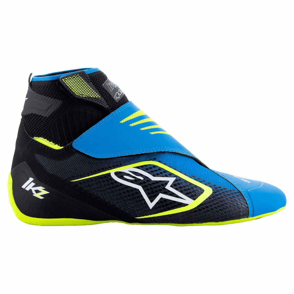 Sapatos Alpinestars Tech-1 KZ V2, sapatos de karting, preto, azul esmalte e amarelo néon, vista lateral mostrando a parte superior tricotada, fecho de tira dupla e logótipo branco proeminente da Alpinestars, concebidos para sensibilidade aos pedais no desporto automóvel
