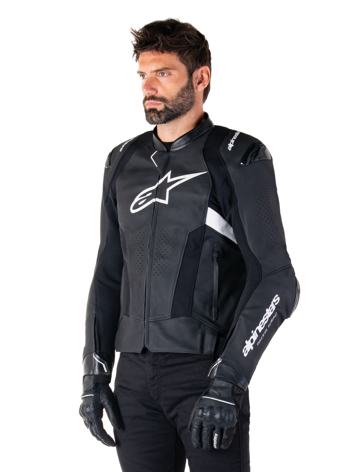 Man wearing the Alpinestars Missile V3 Airflow Leather Jacket, Black and White motorcycle jacket, premium perforated leather for airflow, white Alpinestars logo on chest and sleeve, racing-inspired sport fit, worn with black gloves and pants.