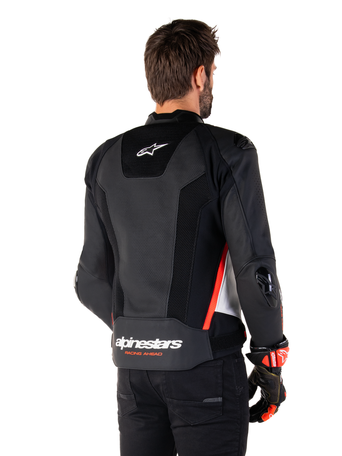 Casaco de Couro Alpinestars Missile V3 Airflow, vista traseira, preto, branco e vermelho fluo, com perfurações extensas para ventilação, sliders DFS externos nos ombros e cotovelos, e logótipo Alpinestars na parte inferior das costas.