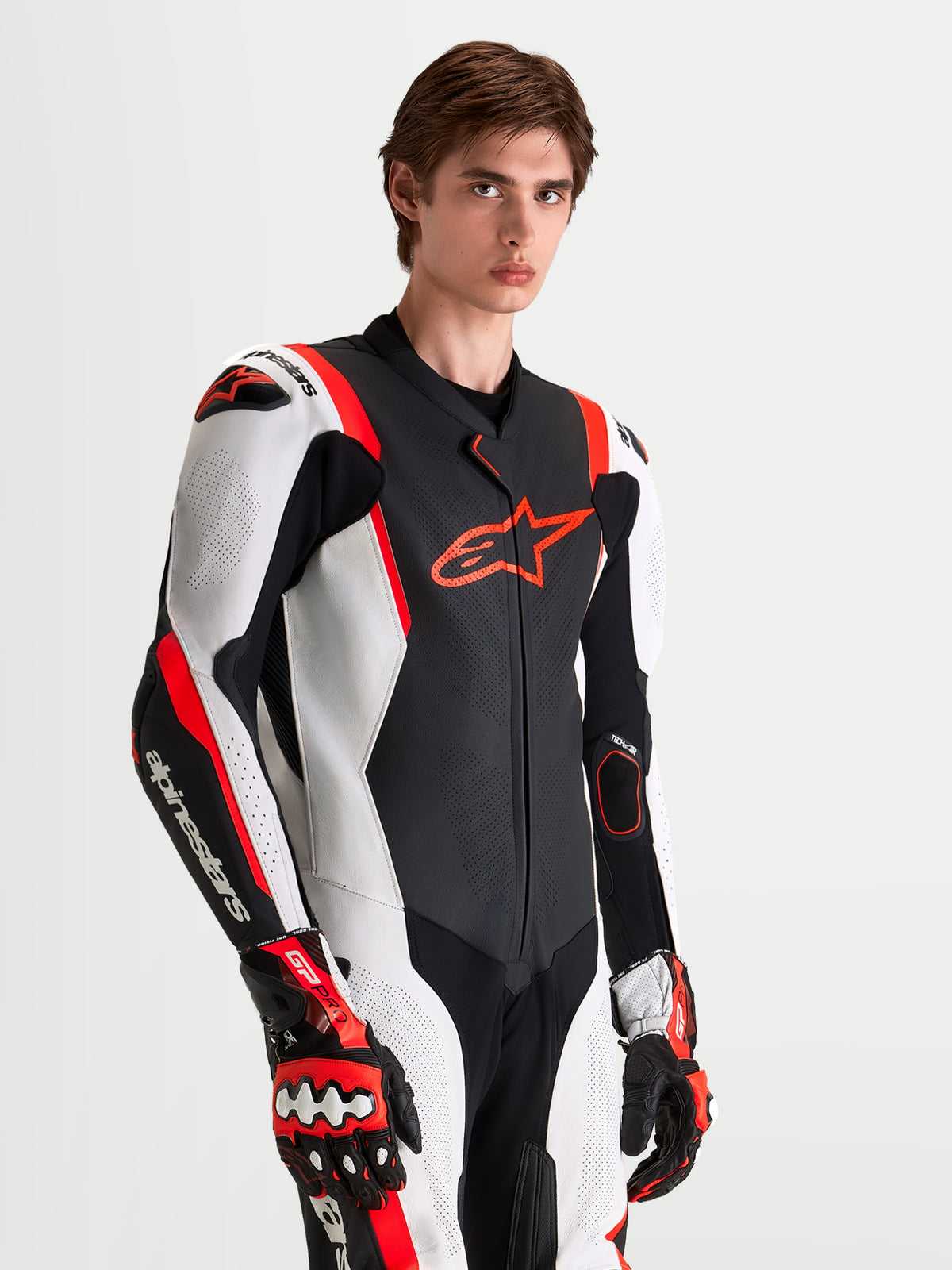 Alpinestars Missile V3 Leather Suit 1 Pc, Men's One-Piece Motorcycle Racing Suit in Black, White, and Red Fluo, featuring AAA-rated leather construction, DFS shoulder armor, and integrated ventilation panels