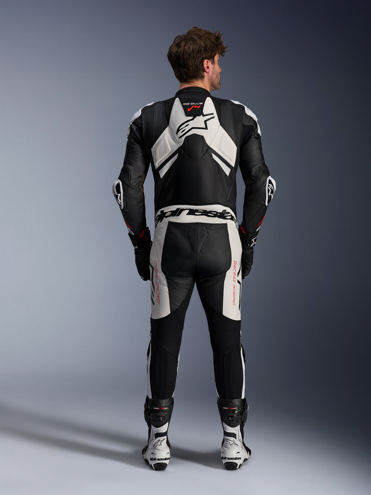 Alpinestars GP Plus V4 Sprint 1 Piece Leather Suit, Men's Racing Gear in Black and White with Red Fluo and aerodynamic hump.