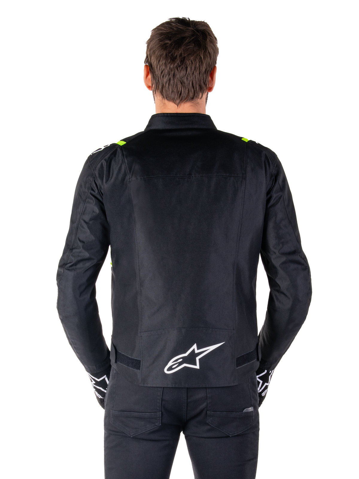 Alpinestars T-SPS V2 Waterproof Jacket, vista traseira, preto com detalhes em amarelo fluo nos ombros e logótipo de estrela branco na parte inferior das costas, casaco de motociclismo têxtil com silhueta desportiva, usado por modelo masculino
