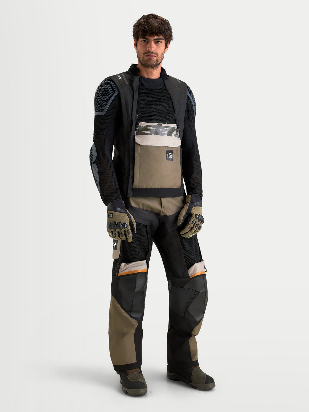 Alpinestars Harok V2 Drystar Jacket, Men's adventure motorcycle jacket in aluminum, walnut, and black, featuring a modular ventilated chassis and waterproof construction worn by a male model.