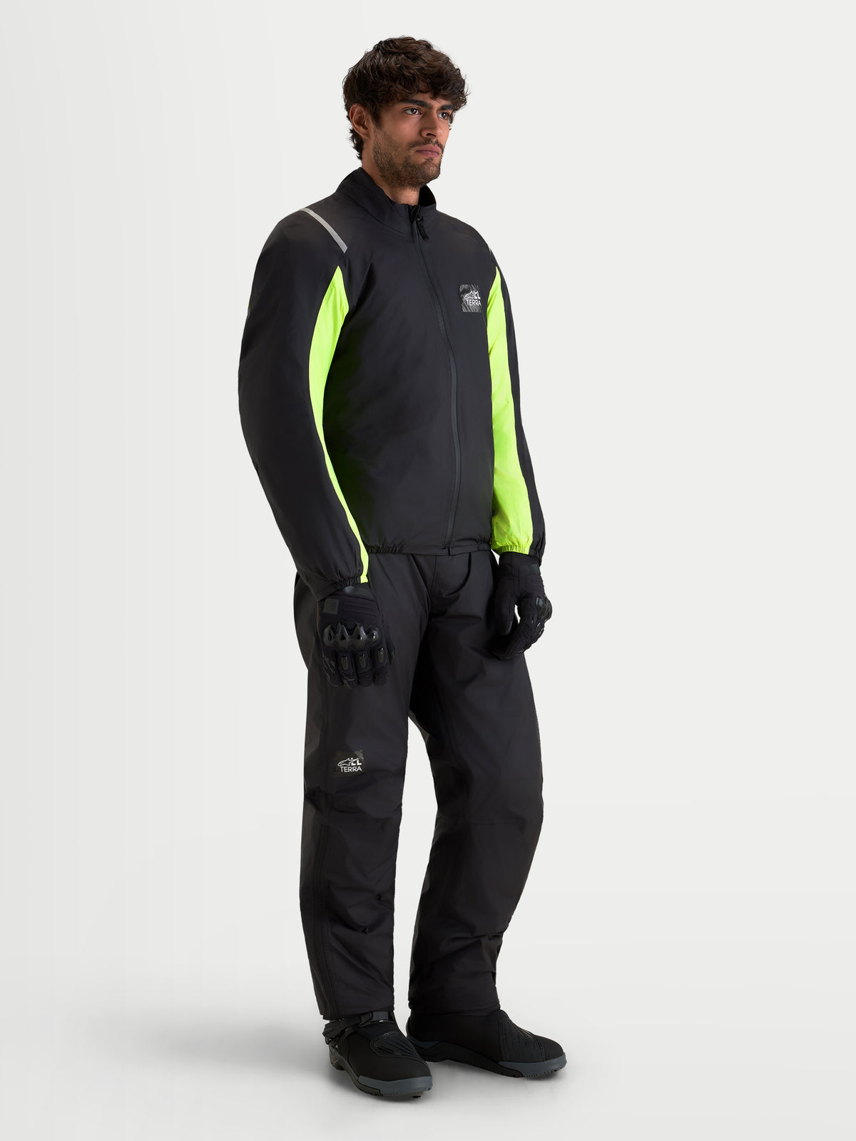 Alpinestars Harok V2 Drystar Jacket, Men's adventure motorcycle jacket in black and fluorescent yellow, worn with matching riding gear on an on-model product shot