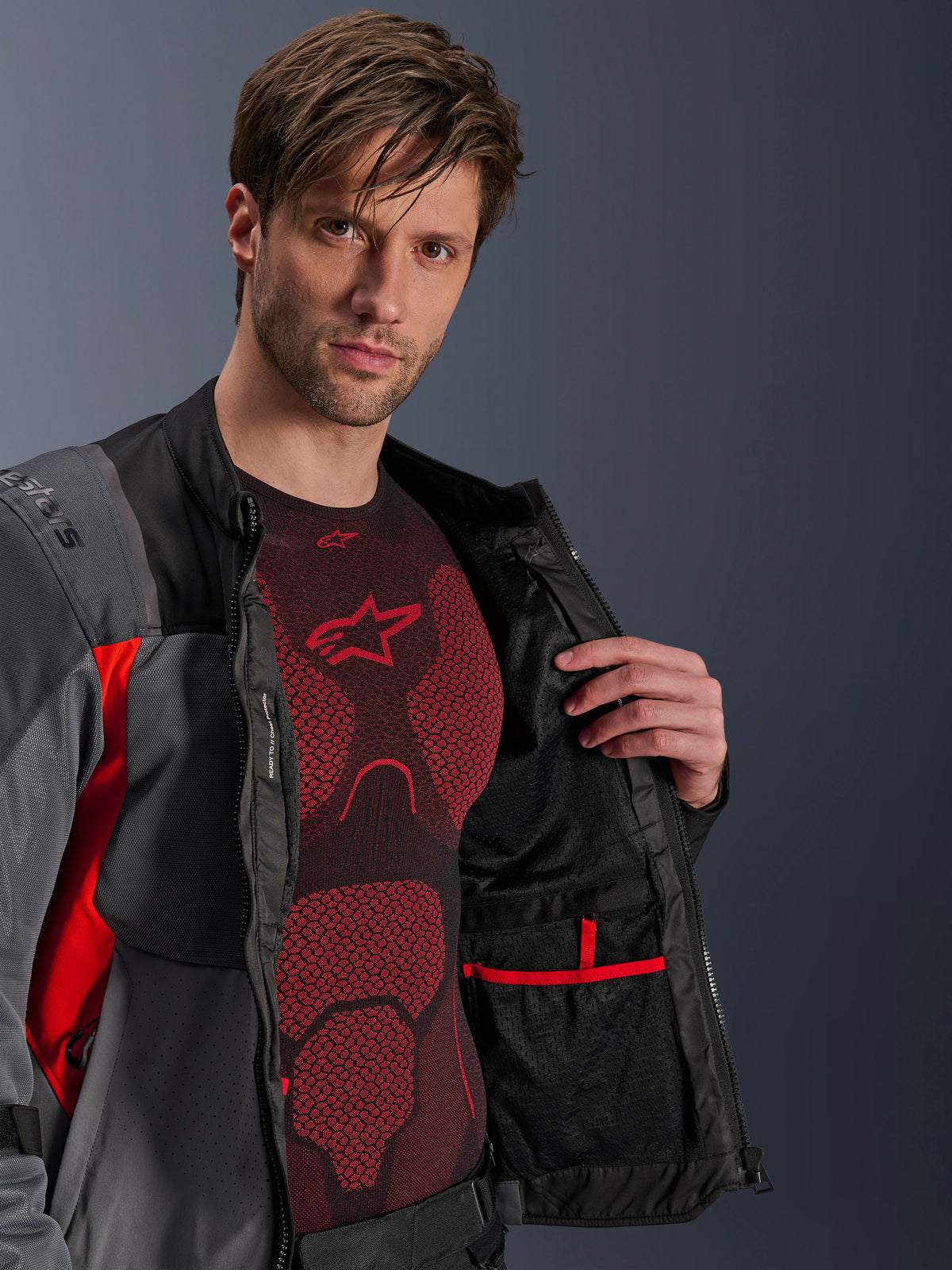 Alpinestars ST-2 Air Jacket, Men's Adventure Motorcycle Jacket, Gray and Red, unzipped showing internal mesh lining and pocket.