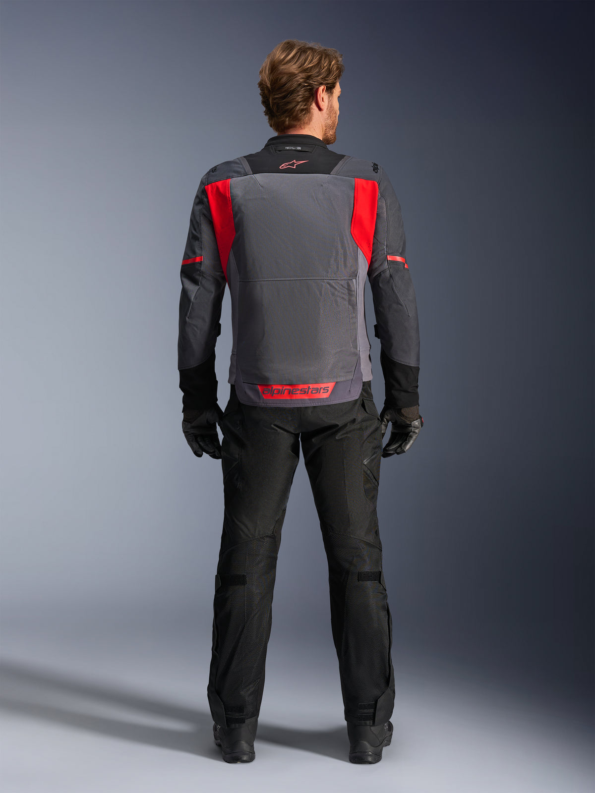 Alpinestars ST-2 Air Jacket, Men's Gray and Red motorcycle touring jacket, rear view with mesh ventilation panels.