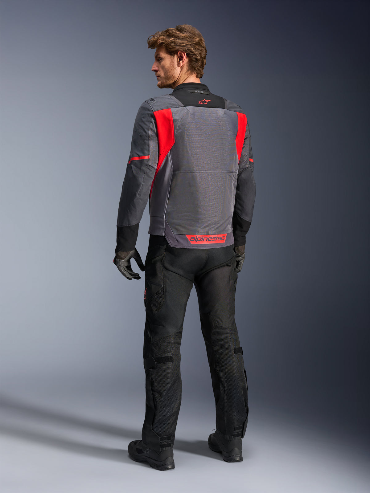 Alpinestars ST-2 Air Jacket for men in Gray and Red, with a mesh back panel for ventilated summer adventure touring.