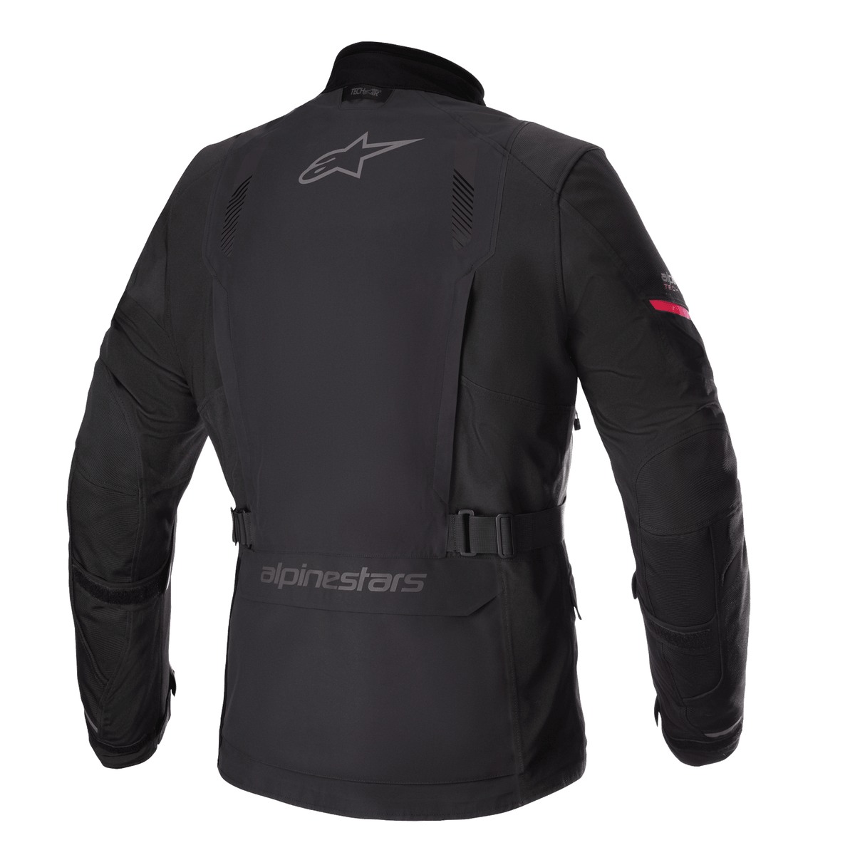 Casaco Alpinestars Monteira Drystar® XF, casaco de motociclismo para turismo de aventura, preto com pormenor vermelho vivo na manga, perfil traseiro com logótipos Alpinestars cinzentos, cinto de cintura ajustável e camada exterior têxtil impermeável durável