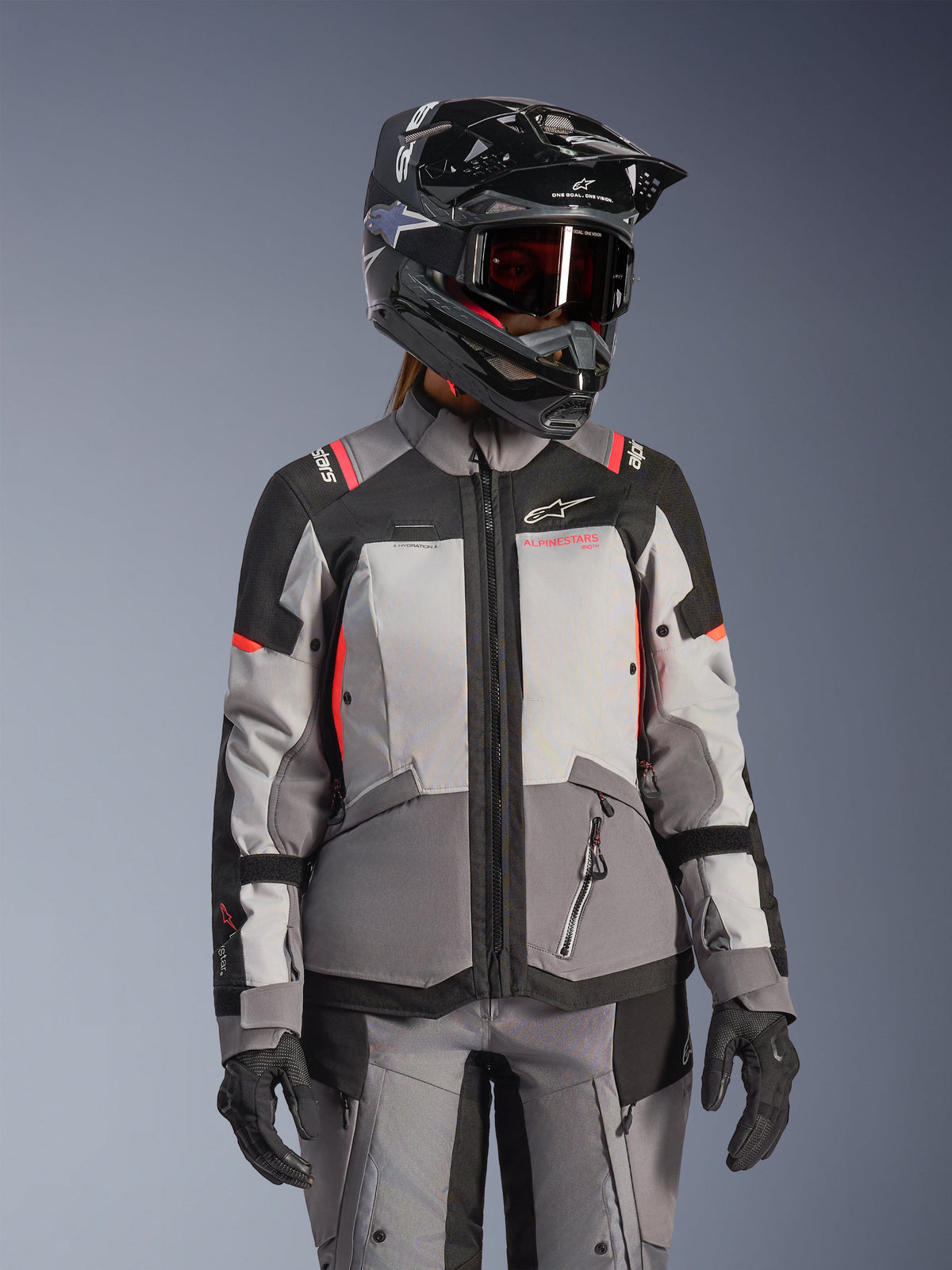 Alpinestars Stella Andes V4 Drystar, casaco de moto para mulher, cinzento e preto com detalhes coral, impermeável.