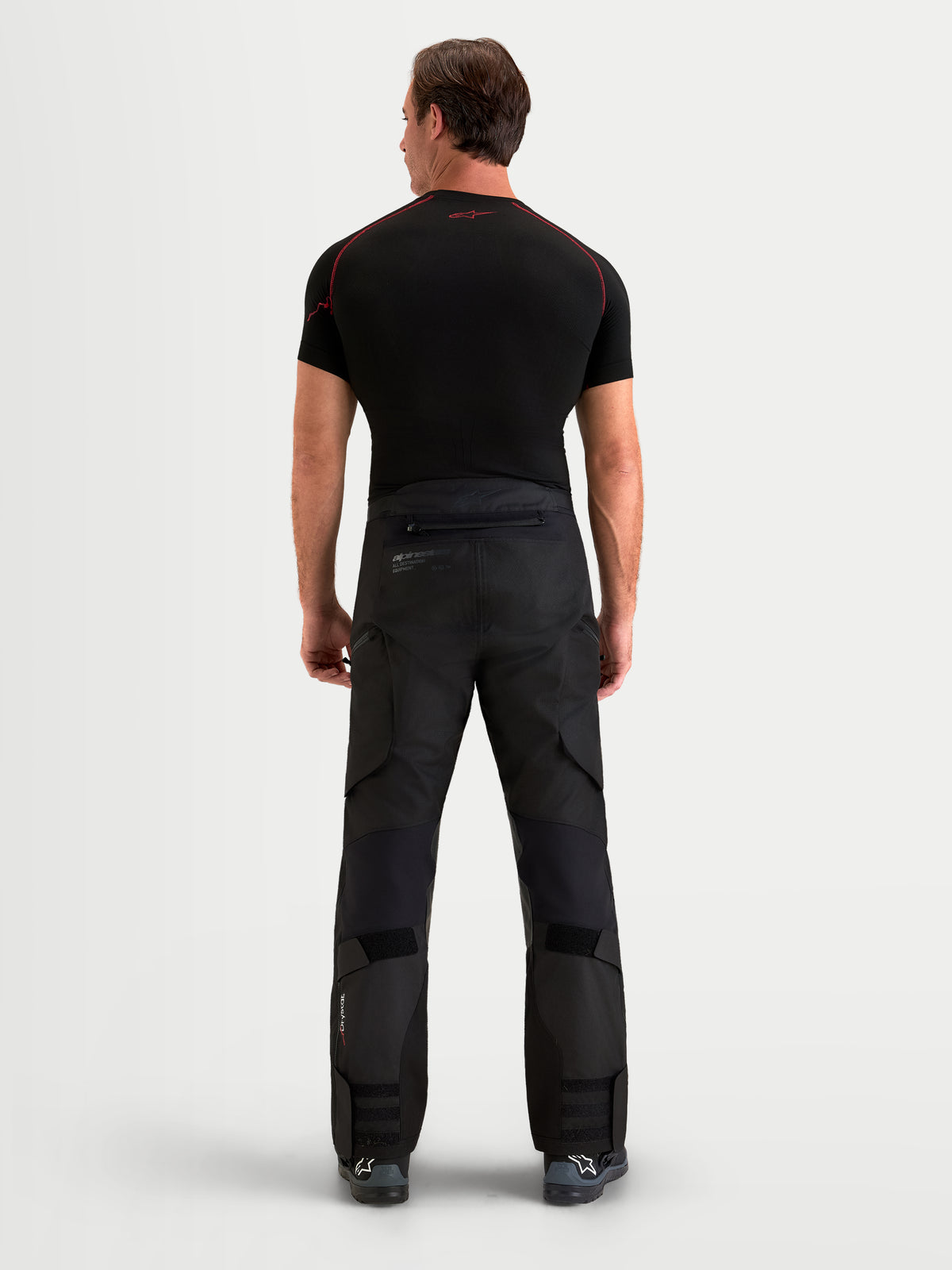Alpinestars Harok V2 Drystar Pants, All-Terrain Adventure Motorcycle Pants, Men's Black textile riding pants with ripstop construction and rear view on model