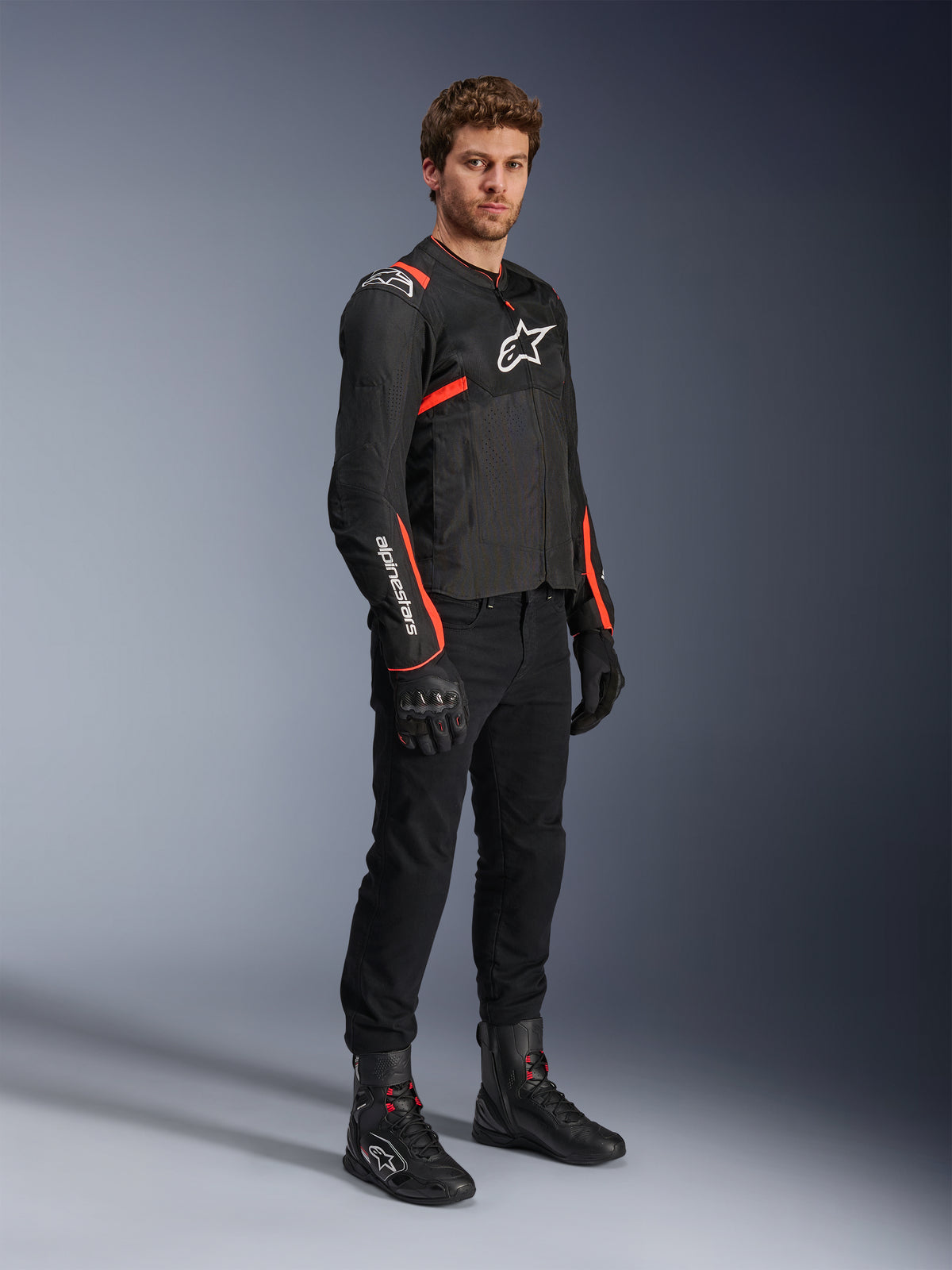 Casaco de moto Alpinestars T-SPS Air V2 masculino, preto e vermelho fluorescente, com painéis de malha ventilada.