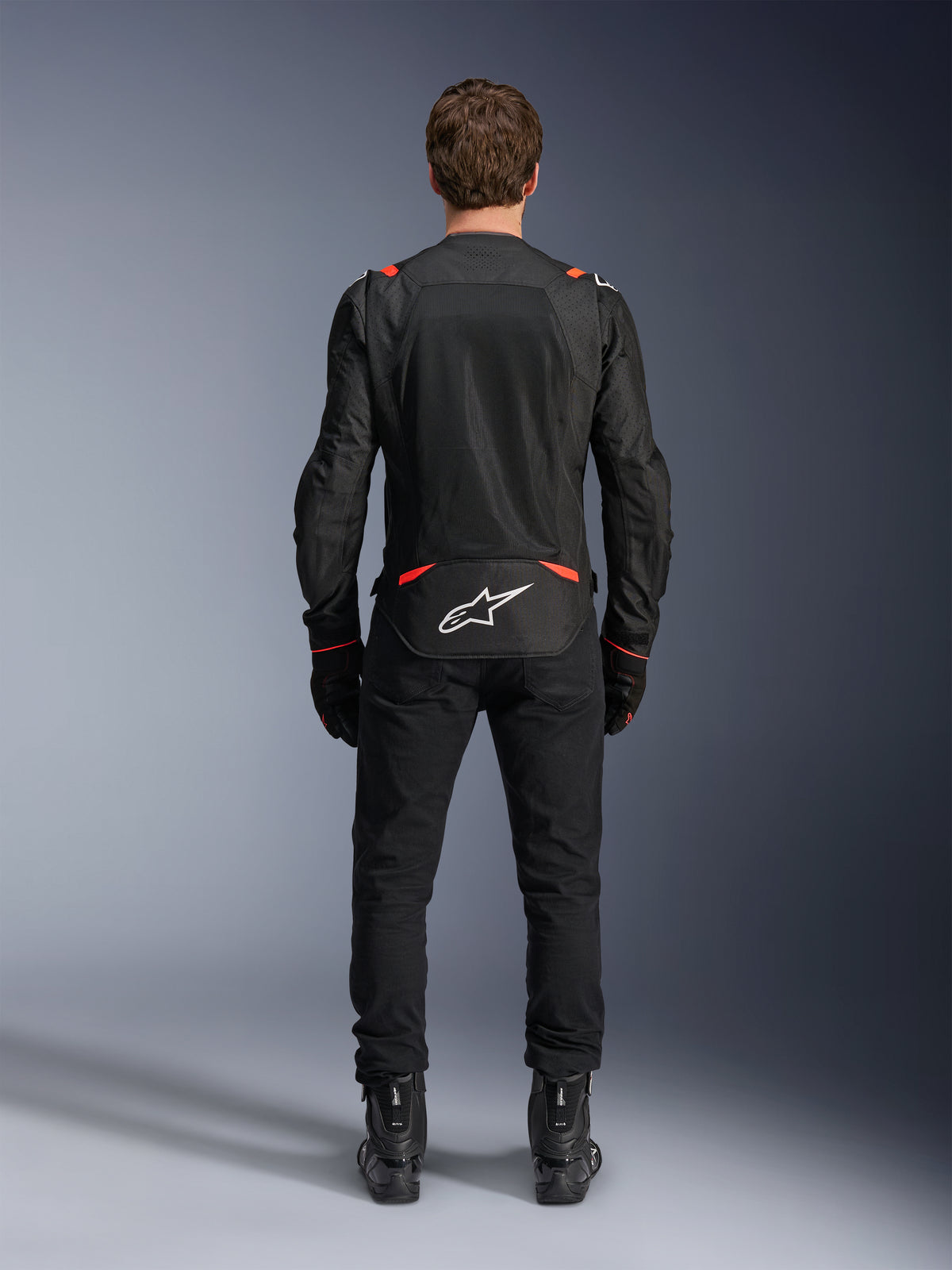 Alpinestars T-SPS Air V2, casaco de moto têxtil para homem, preto e vermelho fluo, vista traseira com painéis de malha para ventilação máxima, logótipo Astars branco, condução urbana