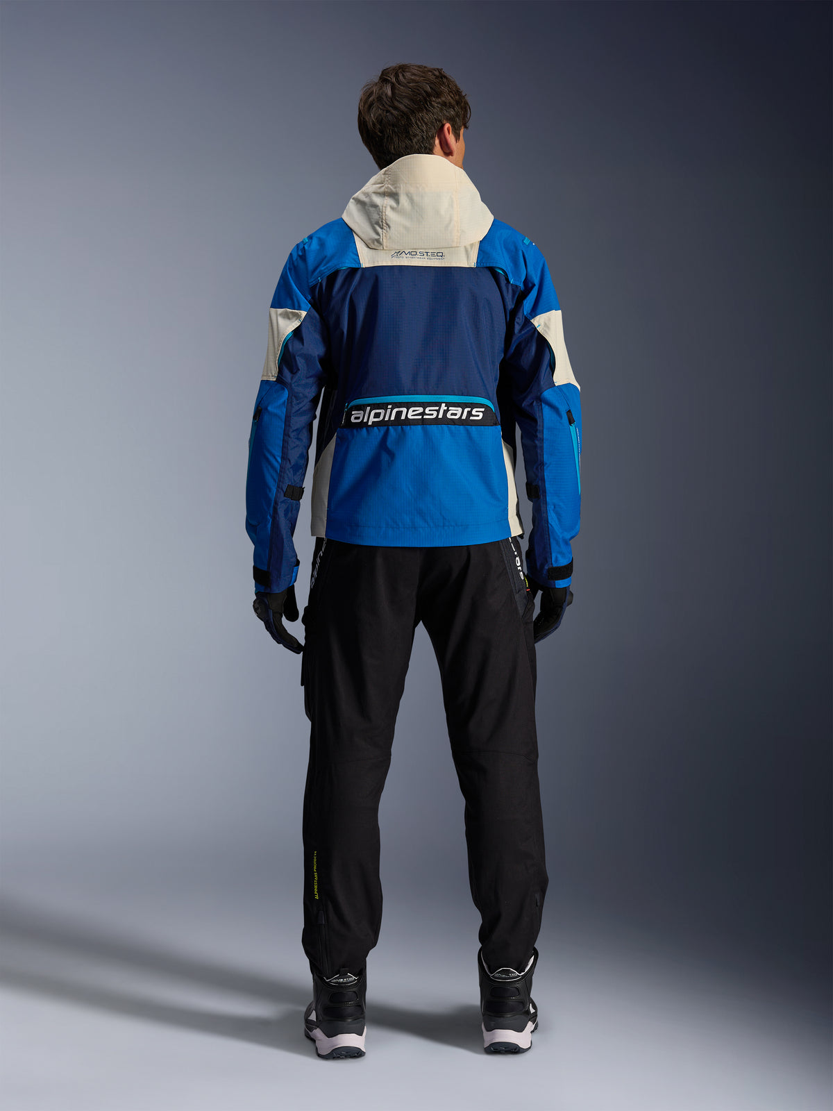 Alpinestars Mogress Air, casaco de moto para homem, azul e bege, vista traseira com capuz, tecido ripstop, certificado CE