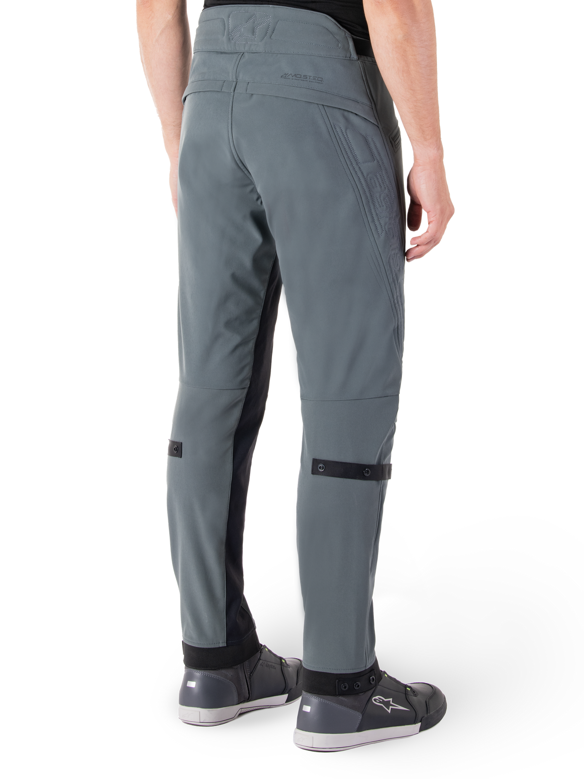 Alpinestars Alden Pants, Urban Gray, rear side view, streetwear-inspired technical riding pants with quilted detailing on the waist and black calf straps, paired with gray riding shoes, modern urban motorcycle gear