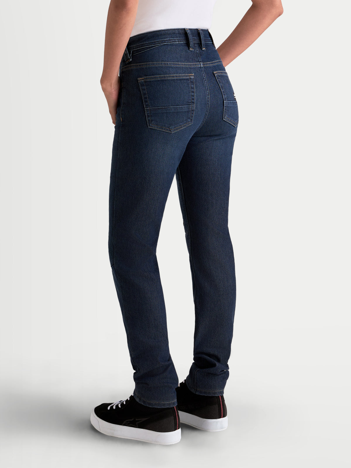 Alpinestars Stella Flex-AST 7 Denim Pants Short, women's urban motorcycle riding jeans in dark blue, rear view on a model showing single-layer stretch denim construction and five-pocket styling