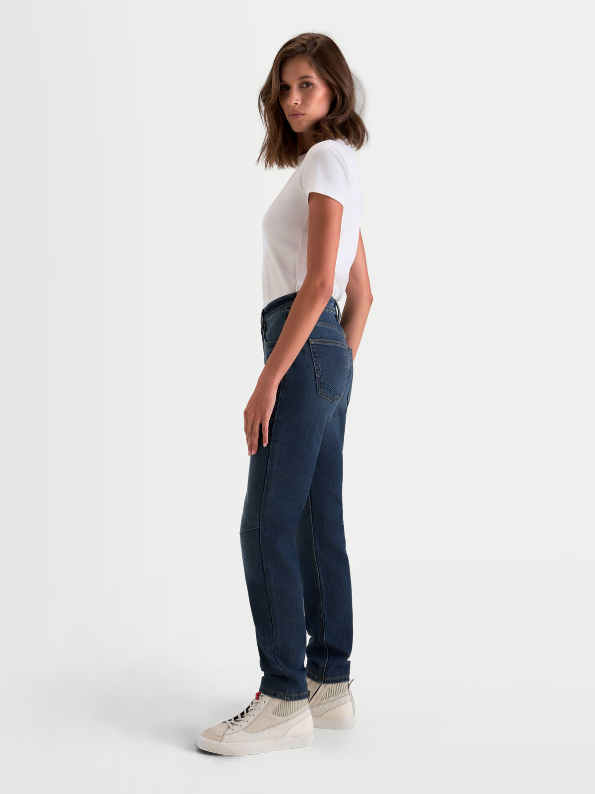 Alpinestars Stella Flex-AST 5 Denim Pants Short, women's urban motorcycle denim pants in indigo washed, side profile view worn by a model with a white t-shirt, A-rated single-layer protective riding jeans