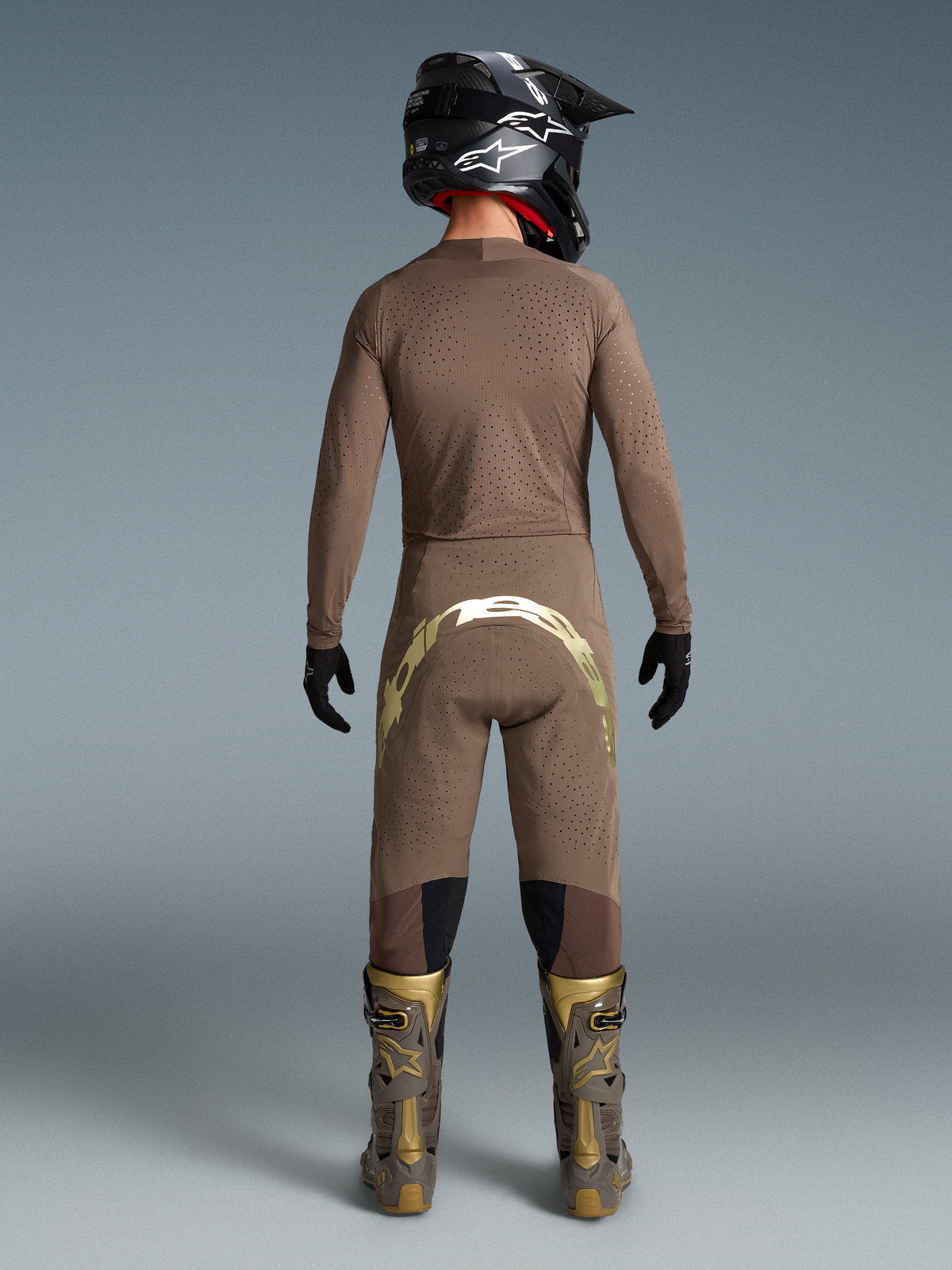 Alpinestars Limited Edition Supertech Air Gold Gear Set, men's Earth Brown and gold ventilated motocross outfit, back view.