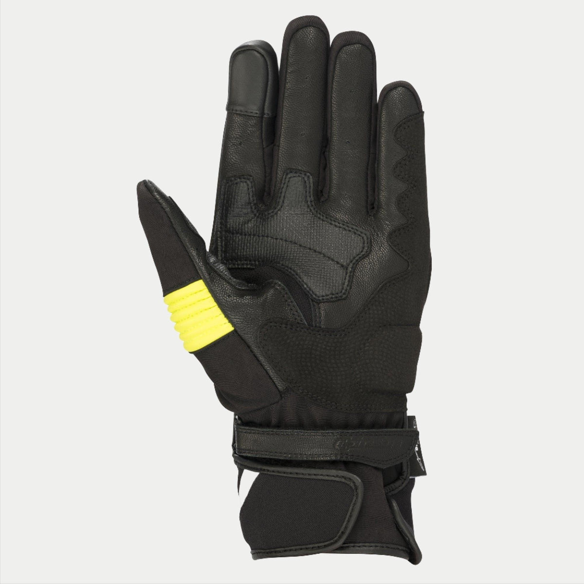 Luvas Alpinestars T-SP W Drystar®, pretas e amarelo fluorescente, vista da palma exibindo construção em pele de cabra com detalhes em amarelo fluorescente no polegar, pontas dos dedos compatíveis com ecrã tátil e fecho de pulso duplo com gancho e laço.