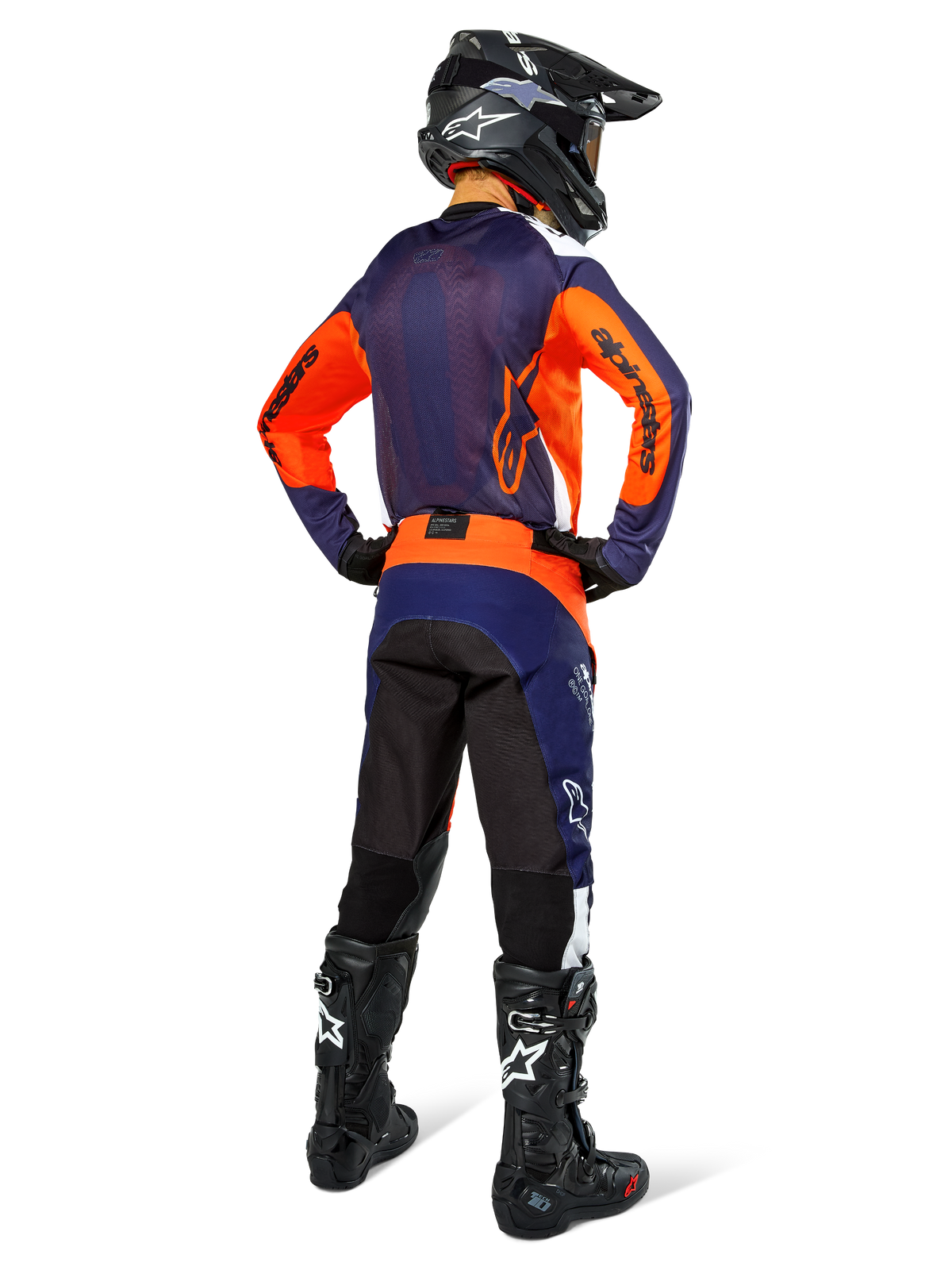 Motocross rider wearing complete racing gear from the back, Navy and orange jersey, Pro-Dura Pants in Navy Hot Orange White, black helmet and black boots, professional off-road racing outfit ensemble.