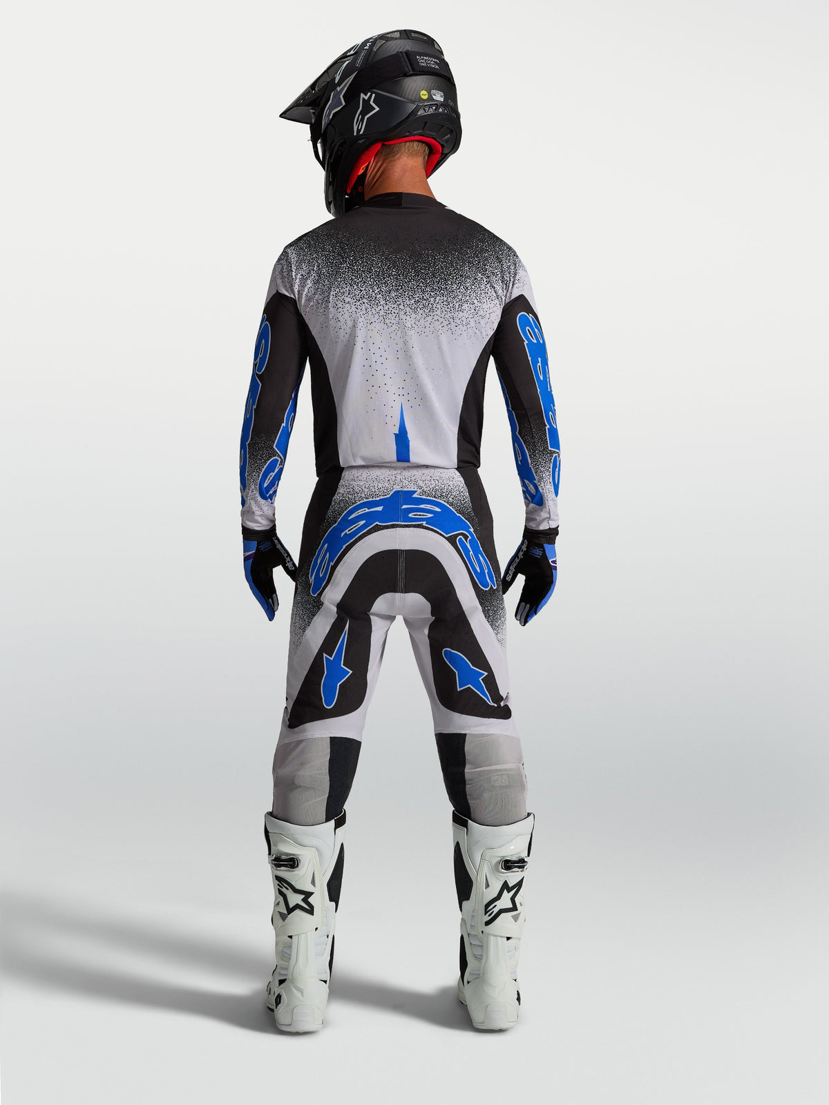 Alpinestars Supertech Hiten AFD, calças de motocross para homem, azuis e brancas, vista traseira com ajuste atlético.