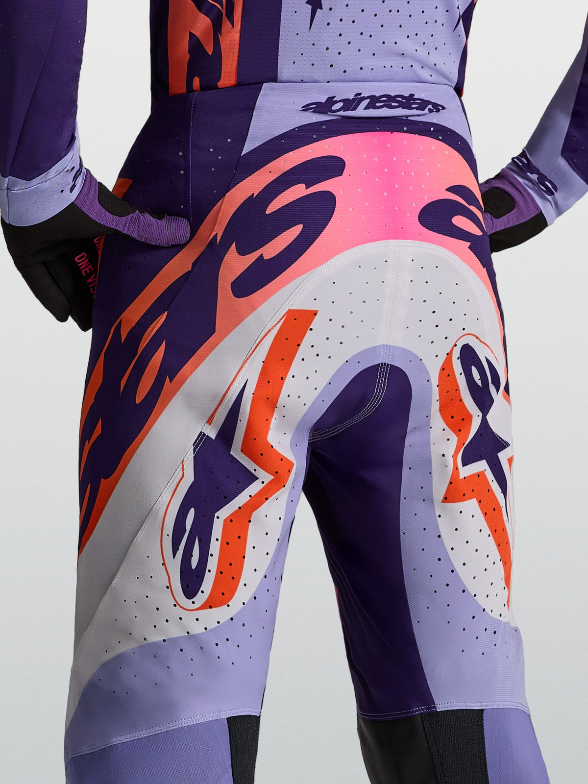 Alpinestars Supertech Dyna, calças de motocross para homem, roxo e rosa flúor, com ajuste atlético ventilado.