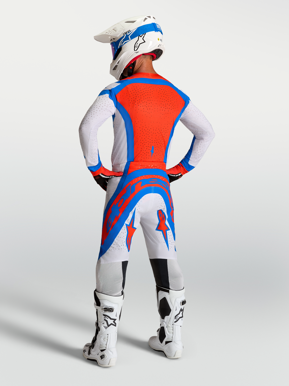 Alpinestars Supertech Vesta, calças de motocross para homem, vermelhas e brancas, painéis ventilados, vista traseira