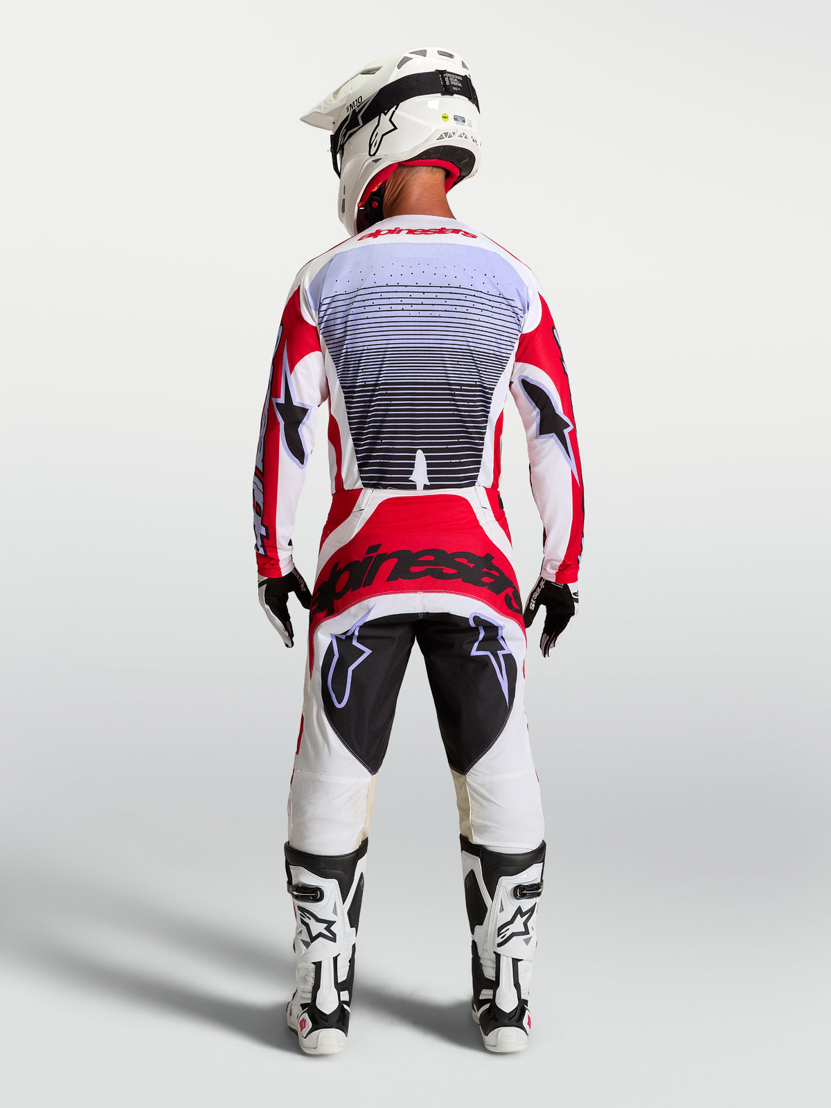 Alpinestars Calças Techstar Maven, calças de motocross vermelhas e brancas, vista traseira com ajuste race atlético