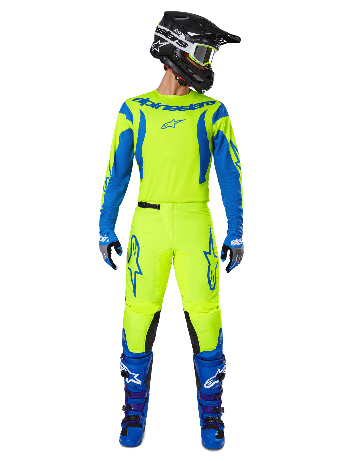 Alpinestars 2025 Fluid Haul Pants, calças de motocross, amarelo néon e azul, usadas como um equipamento de corrida completo com camisola a condizer, botas azuis e capacete preto, com logótipo azul de destaque nas coxas e painéis pretos nos joelhos