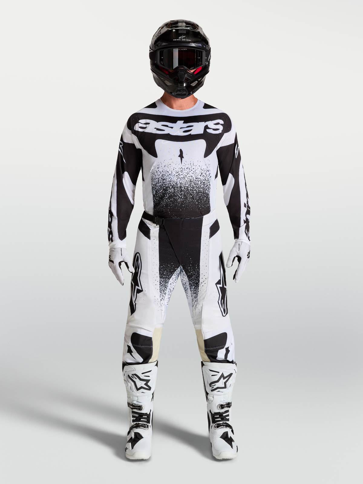 Alpinestars Techstar Swan, conjunto de motocross para homem, branco e preto, com camisola, calças e botas de moto.