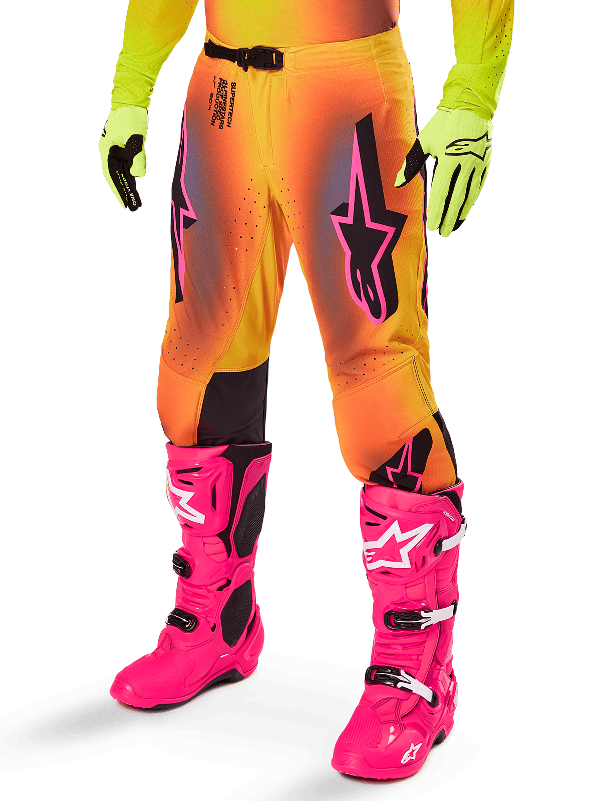 Alpinestars 2025 Supertech Lipan Gear Set, Motocross Pants, Yellow and Orange gradient with Pink and Purple accents, featuring bold black Alpinestars logos on the thighs, worn with yellow gloves and bright pink motocross boots.