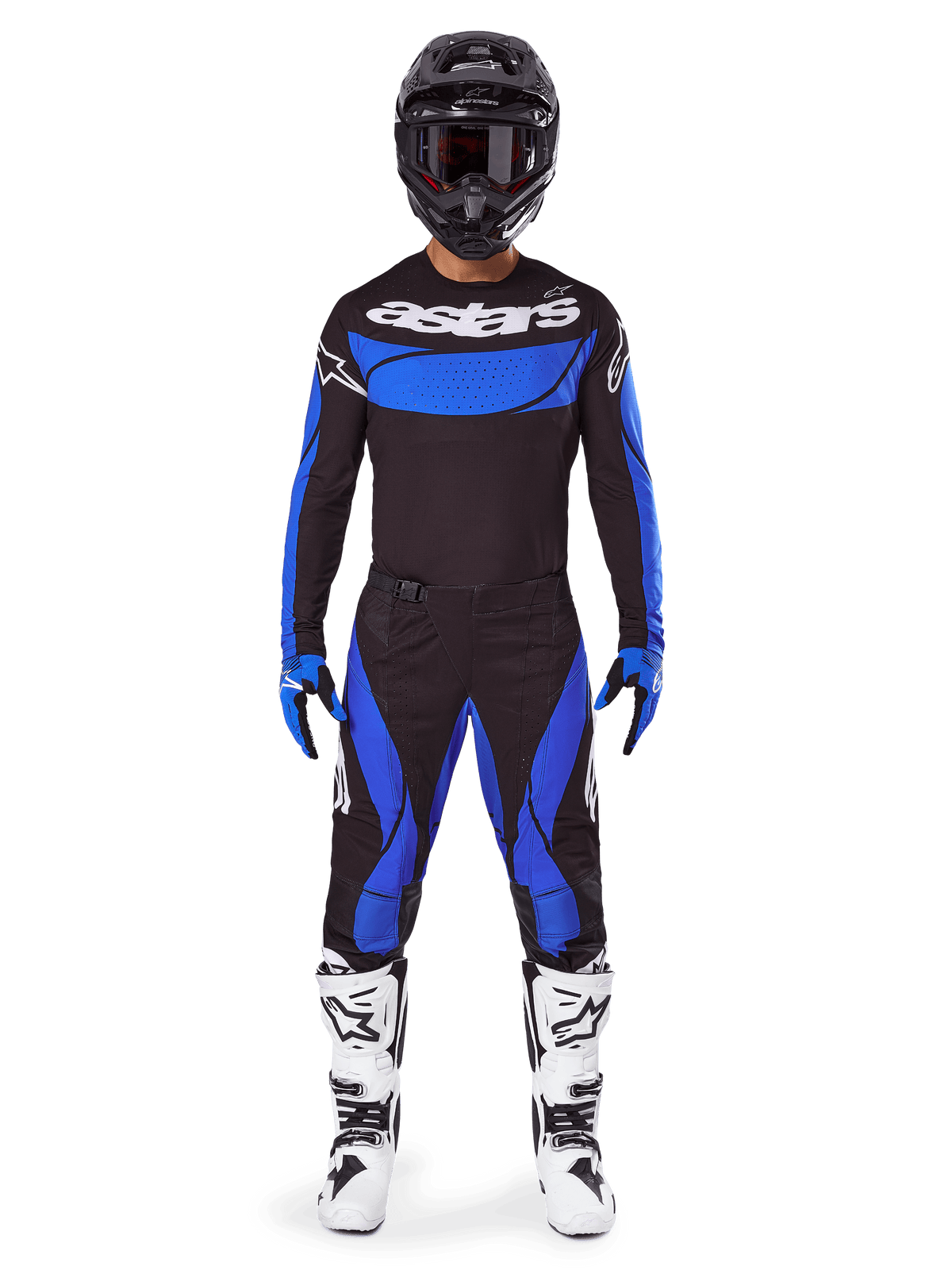 Motocross rider wearing the Alpinestars 2025 Techstar Dreem Gear Set, black jersey with blue chest panel and sleeves, matching black and blue pants, black helmet with goggles, and white boots, complete coordinated motocross outfit for off-road racing.
